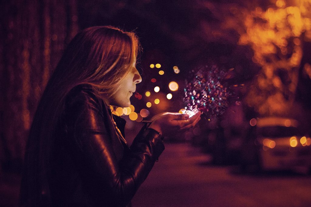 Magic dust blew from a girls palm